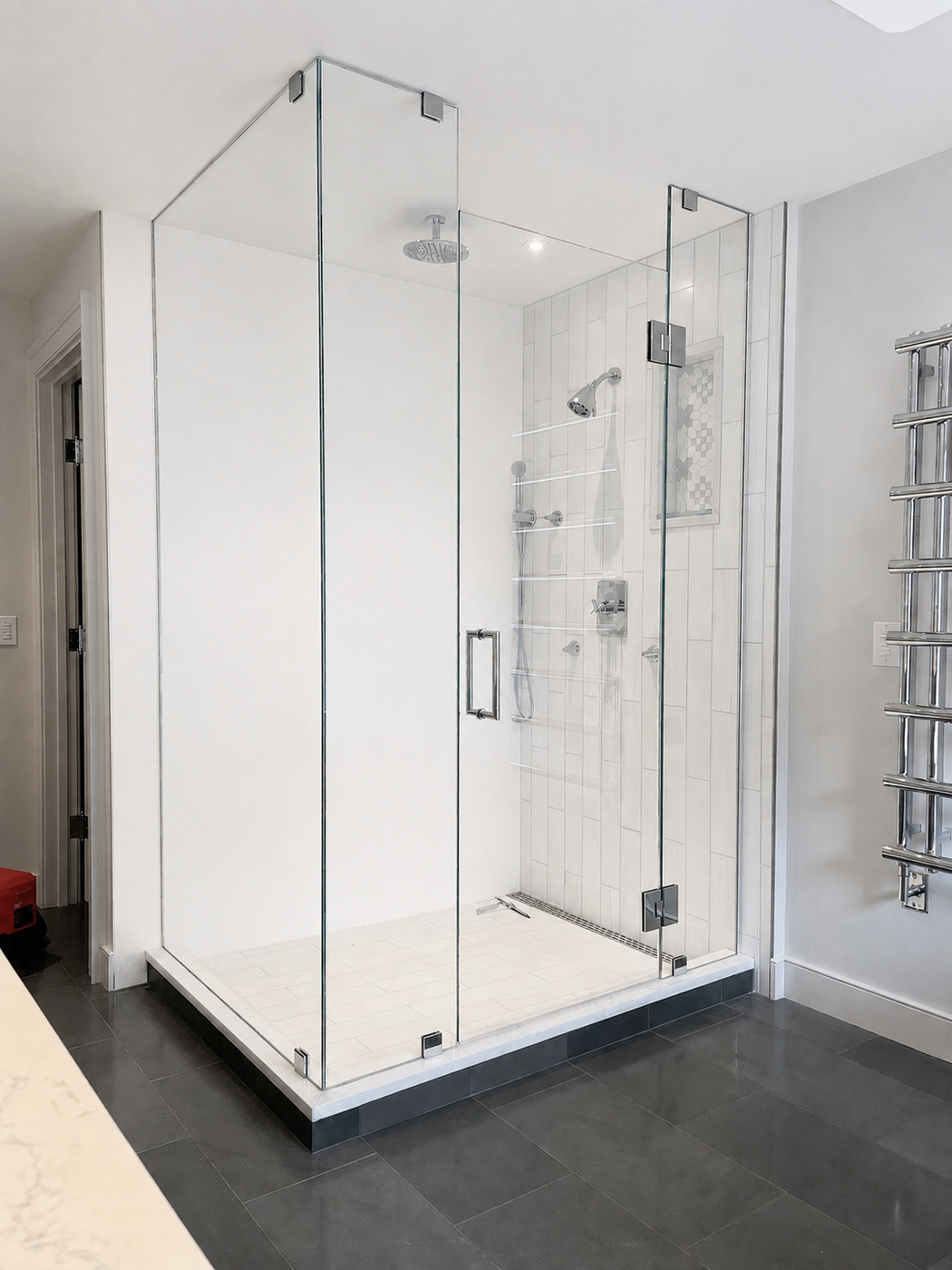 Clear frameless corner glass shower enclosure with chrome hardware