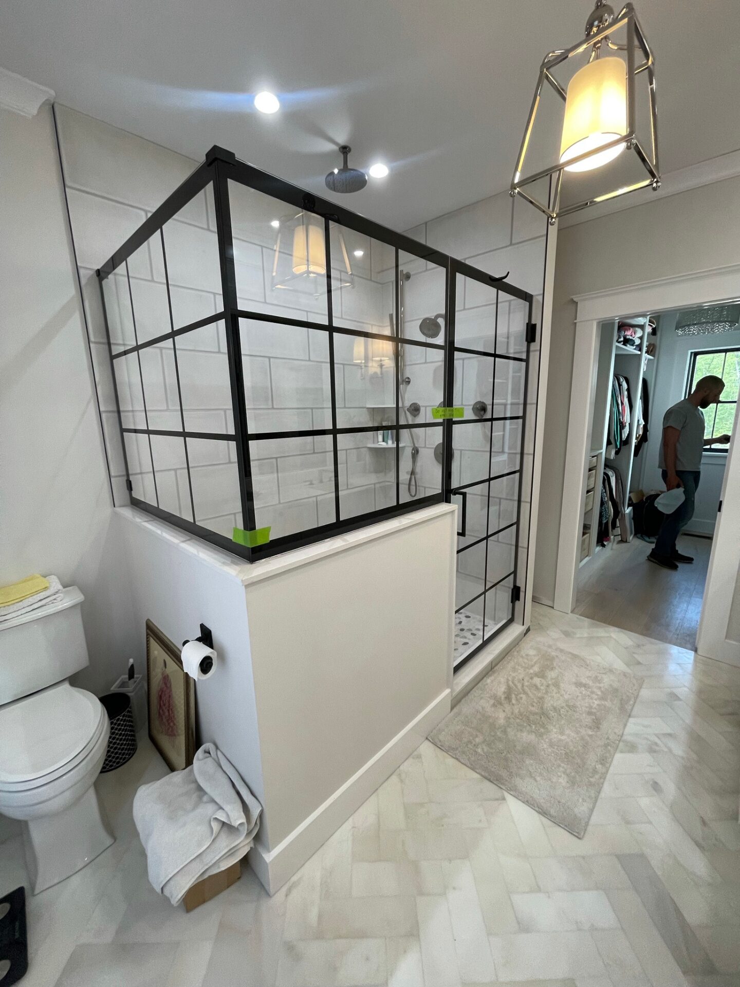 Black grid-style frameless glass shower enclosure by Grand Glasswork in a Rhode Island bathroom